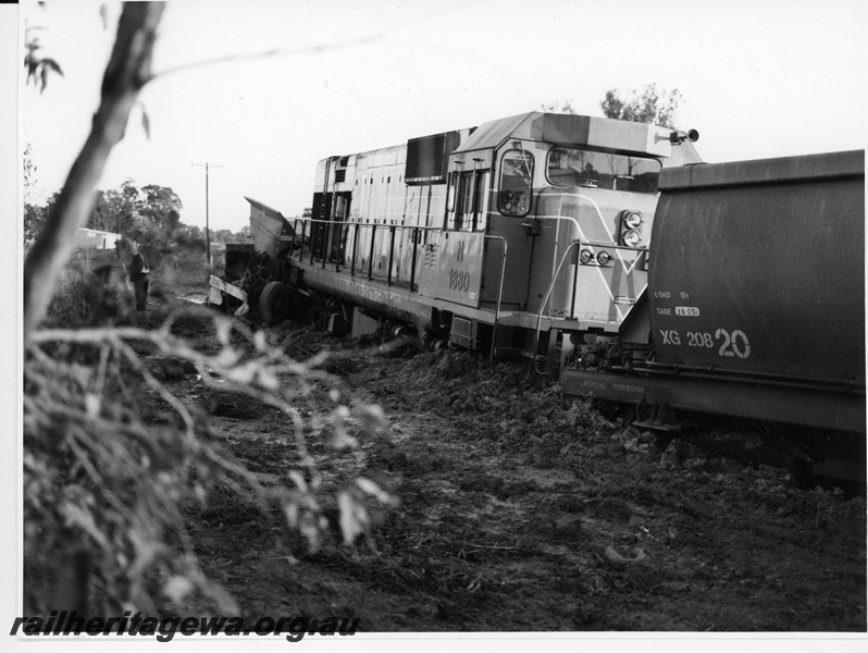 P10950
3 of 7. N class 1880 together with XG class 20820, coal hopper, in 'the dirt' following derailment at Wagerup, SWR line. . Date of derailment 11/9/1981
