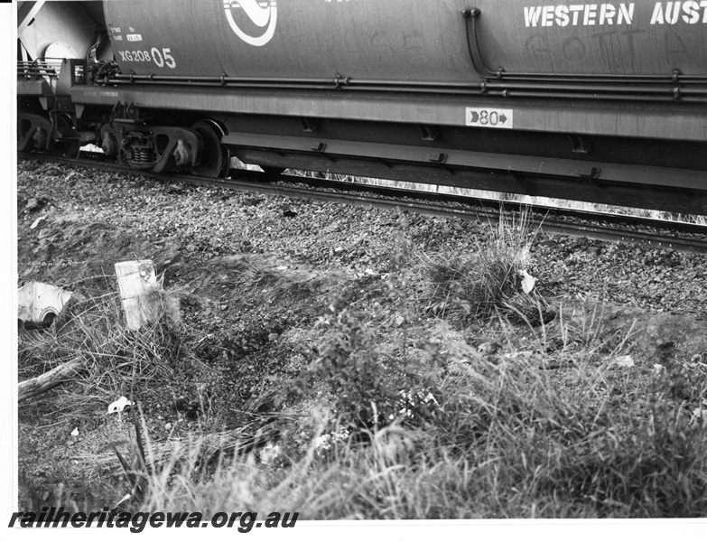 P10954
7 of 7. A view of XG class 20805 coal hopper derailed at Wagerup, SWR Line, depicting one side of the leading bogie derailed to the inside of the rail while the opposite side is still on rail. Date of derailment 11/9/1981
