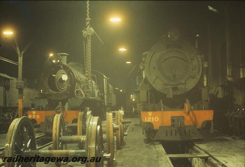 P11277
W class 925, V class 1210, under repairs, driving wheels on service track, East Perth loco shed. ER line.
