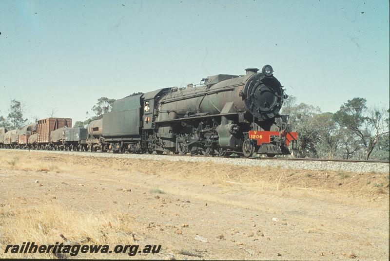 P11290
V class 1206 with auxiliary water tank on goods train. GSR line.
