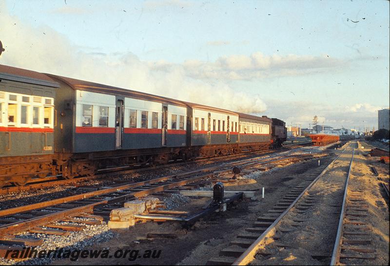 P11433
DD class 596, down suburban passenger, new track being built on right, ballast wagons on new track, Rivervale bank. SWR line.

