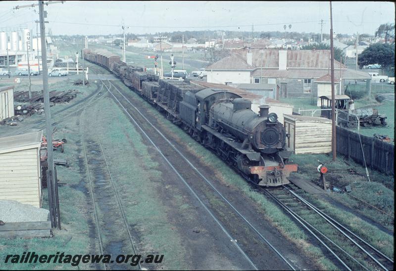 P11540
W class 957, goods train, home signals beyond level crossing, point indicator, gangers sheds, 