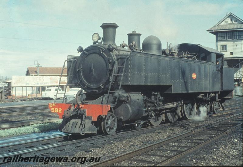 P11575
DM class 582, light engine, part of signal box, leaving down main for East Perth loco shed. ER line.
