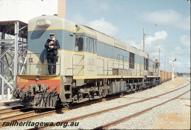 P11730
K class 208, K class, taking first iron ore train to AIS sidings, part of Kwinana signal box behind loco, Kwinana yard. FM line.
