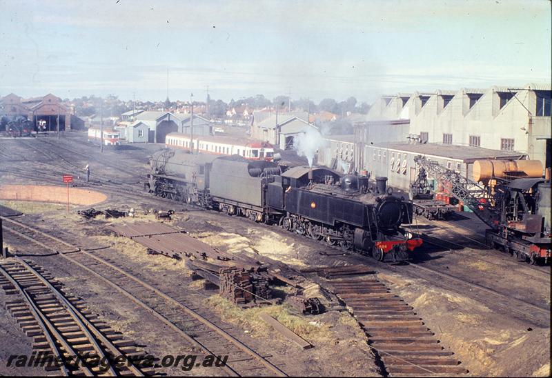 P11891
DM class 584, shunting V class, ADF class and railcars in background, East Perth loco shed. ER line.

