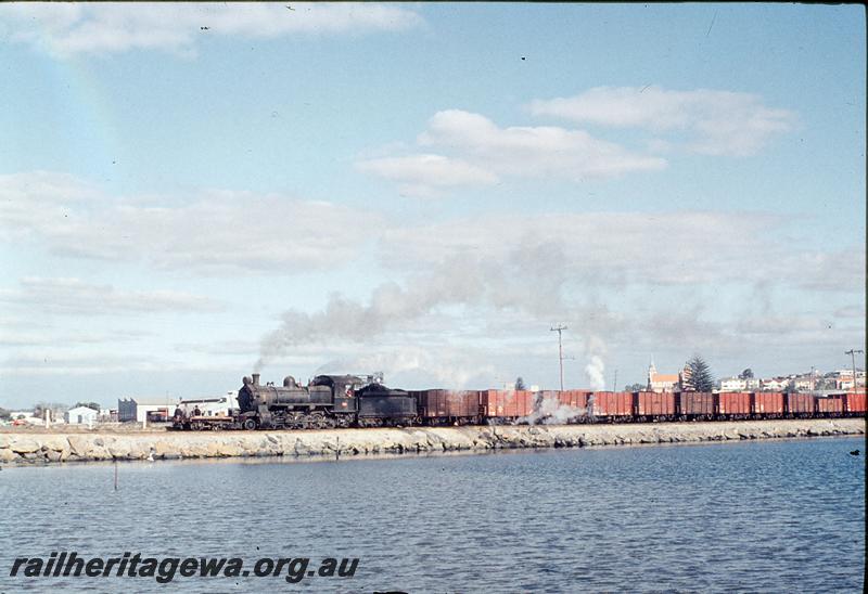 P12183
FS class 454, 1600 ton coal train for Bunbury Powerhouse crossing the plug, W assisting in rear out of sight, Bunbury. SWR line.

