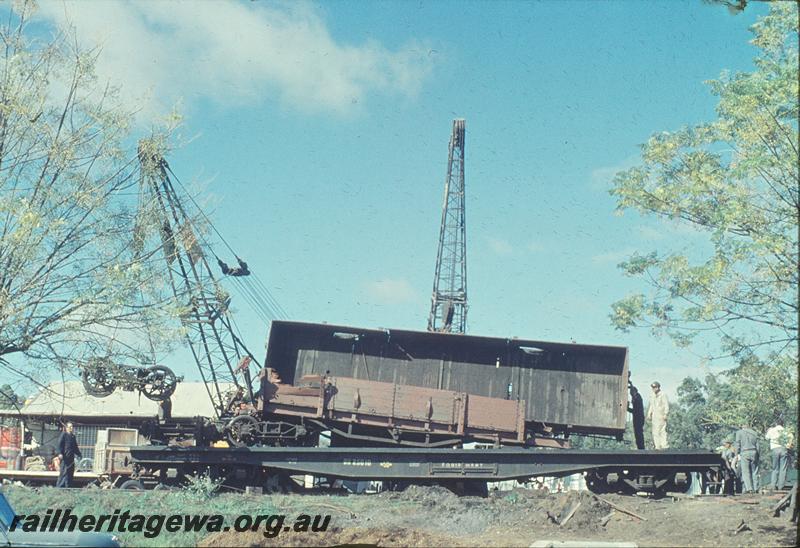 P12222
QU class 25010 in black livery, wreckage of a R class wagon being lifted onto the wagon, Gingin accident. MR line.
