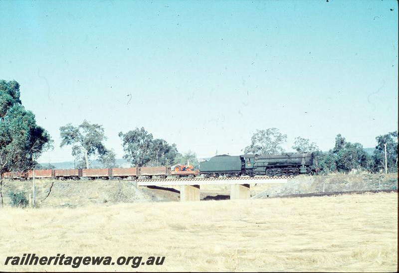 P12444
V class 1213, on 35 goods, bridge, south of Pinjarra, SWR line. Tractor in leading H class wagon.
