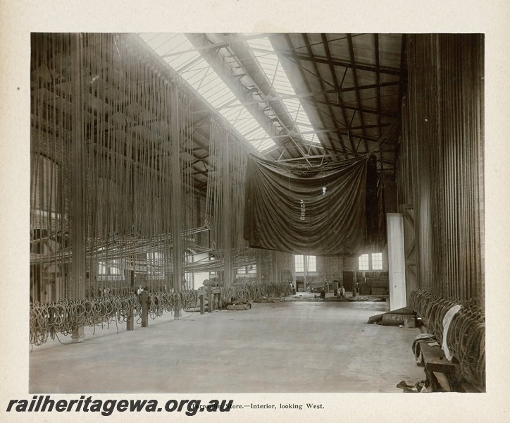 P13411
55 of 67 views taken from an album of photos of the Midland Workshops c1905. Tarpaulin Store, - Interior, Looking West.
