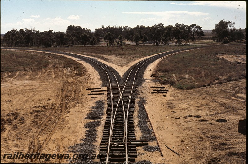 P13447
Trackwork, newly laid line to the Alcoa refinery, Wagerup, SWR line, elevated view along the line showing the diverging lines.
