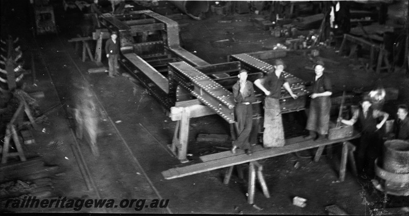 P13545
1 of 6 images of the construction of well wagon QX class 2300, at the Midland Workshops, the wagon was built under the direction of the photographer's father in law Jack Makin, elevated view of the frames of the wagon (Issued to traffic 29.8.1936, classified QX 2300 30.6.1937, rebuilt and rebogied 3.12.1955, reclassified to QY 25.11.1967.)
