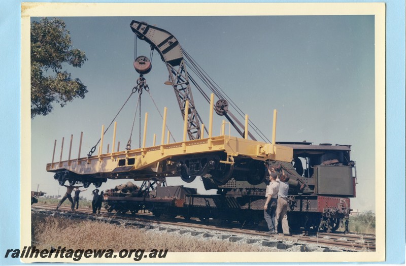 P13596
WF class 3002 standard gauge flat wagon, (later reclassified to WFDY), being lifted by the 25 ton Cravens steam breakdown crane, side and end view.
