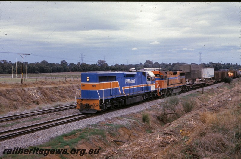 P13809
L class 268 in the one off Westrail Blue, orange and white livery, long hood leading, Hazelmere, heading towards Forrestfield, end and side view

