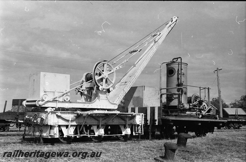 P13933
10 of 32 images of the railway and jetty precincts of Busselton, BB line, six wheel Cowans Sheldon hand crane, end and side view coupled to a steam winch.
