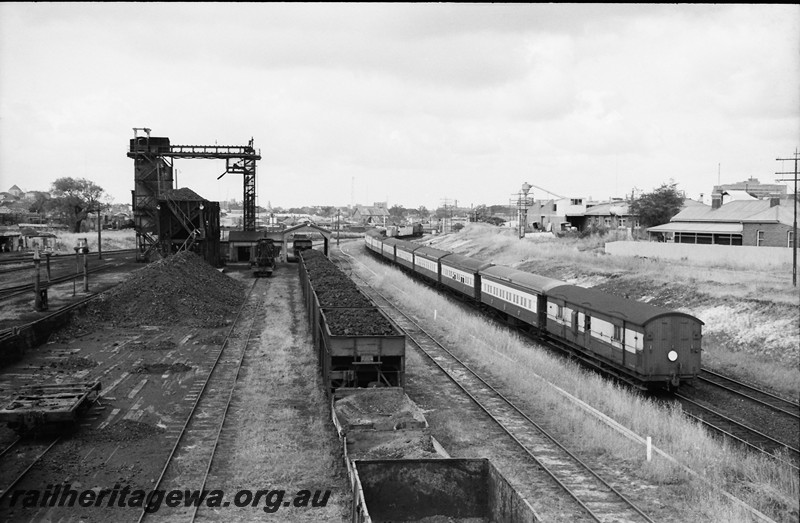 P13986
17 of 17 images of locos, trains and buildings at the East Perth Loco Depot, Coal stages with stockpile, XA class coal hoppers, country passenger train heading towards Perth
