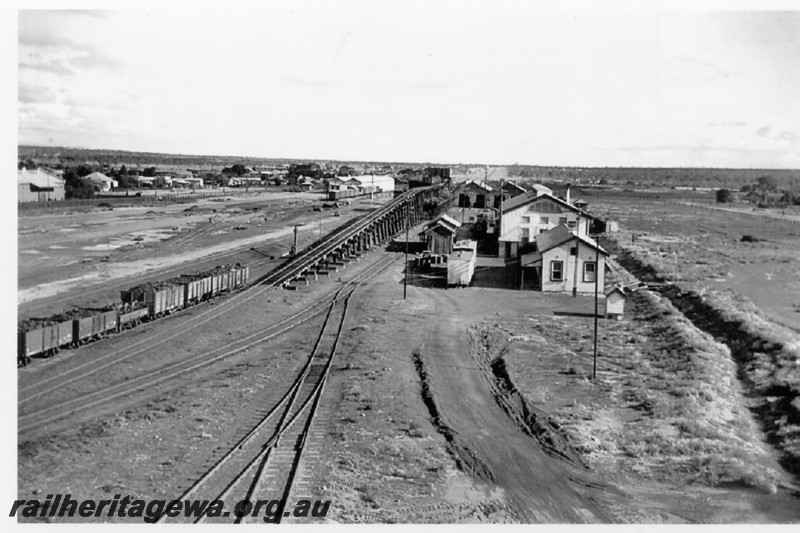 P14206
Overall elevated view of the goods shed, coal stage, loco shed and loco depot office, Kalgoorlie, EGR line, view looking west.
