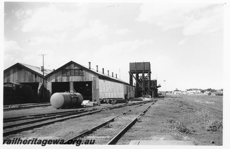 P14207
Loco shed, water tower with large tank, coal stage, Kalgoorlie loco depot, EGR line, view of the rear of the shed looking east.
