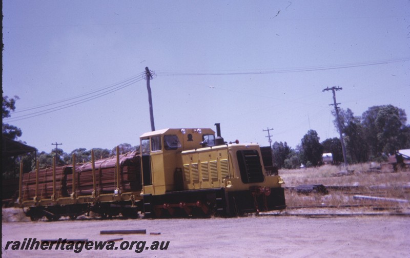 P14355
Millars diesel loco hauling a wagon of sawn timber, side and front view, Yarloop.
