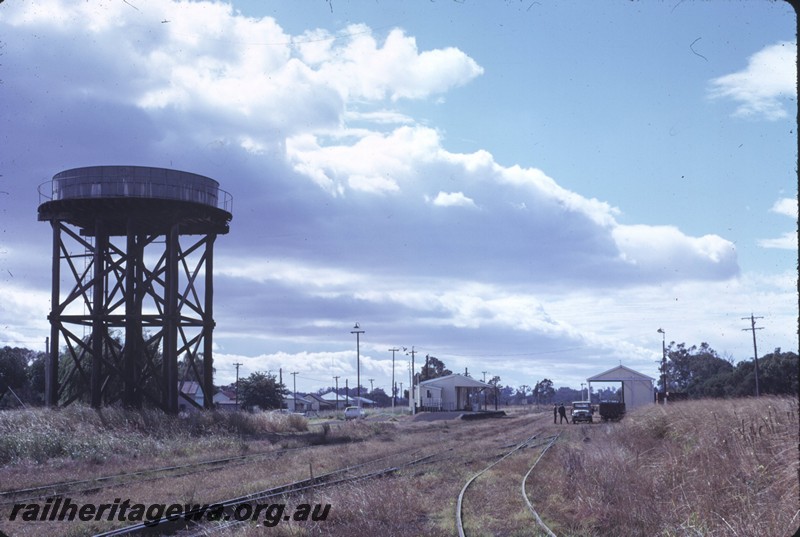 P14360
Water tower, squatters tank, station building and goods shed in the distance, Yarloop, SWR line.
