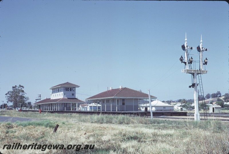 P14363
Station building, including signal box, semaphore signals, water column, side view, Brunswick, SWR line.
