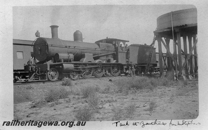 P14464
Commonwealth Railways (CR) G class 4-6-0 loco, water tower, Zanthus, front and side view, taking water, TAR line, 

