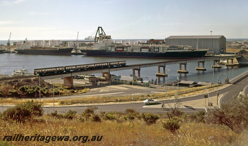 P14476
ADG/ADA/ADG/ADA class railcar set, steel girder bridge, Fremantle, elevated view across the harbour to 12 Berth
