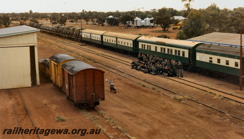 P14514
1 of 4 photos of probably the last military train movement of a unit in Western Australia. 13 field Squadron RAE Army Reserve travelled from Kewdale Yard to Morawa, Photos taken at Morawa, EM line, elevated view of the train showing the carriages hired from The Hotham Valley Railway and the flat wagon with the military vehicles upon them
