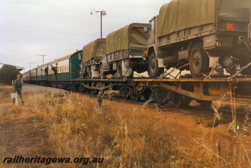 P14517
4 of 4 photos of probably the last military train movement of a unit in Western Australia. 13 field Squadron RAE Army Reserve travelled from Kewdale Yard to Morawa, Photos taken at Morawa, EM line, view of the flat wagons with the military vehicles and the carriages
