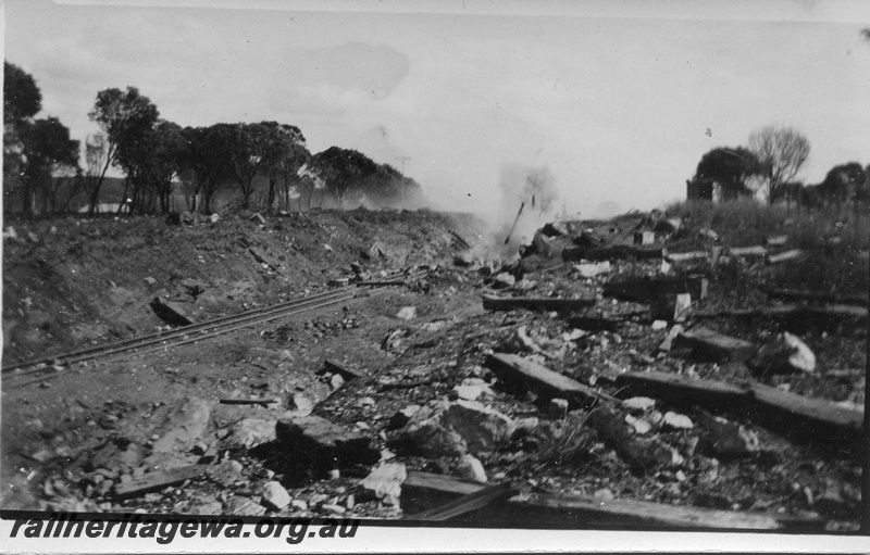 P14519
2 of 5 views of track construction possibly to lower the track through a cutting, explosion just having taken place

