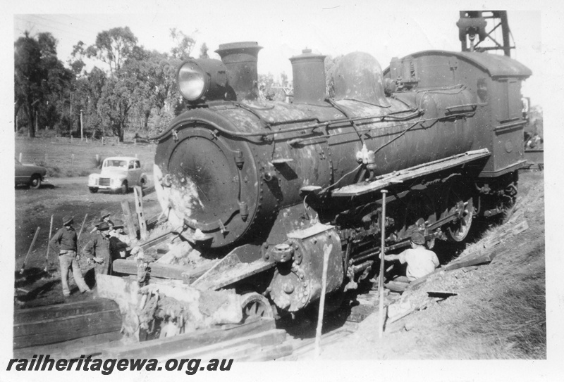 P14696
9 of 10, ES class 332 derailed on 10/6/1951, lying in a creek at Wooroloo, ER line, Jacking the engine up out of the creek, 
