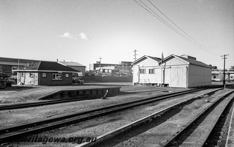 P14815
12 of 21 images of the railway precinct and station buildings at Subiaco, c1969, loading platform, Little Davids point lever, goods shed, view across the yard
