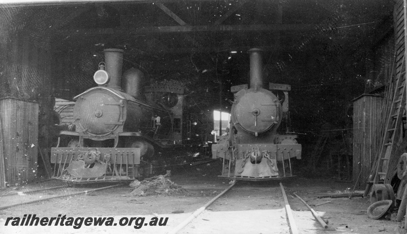 P14869
Kauri Timber Company's steam locomotives in the loco shed, front view, Nannup.
