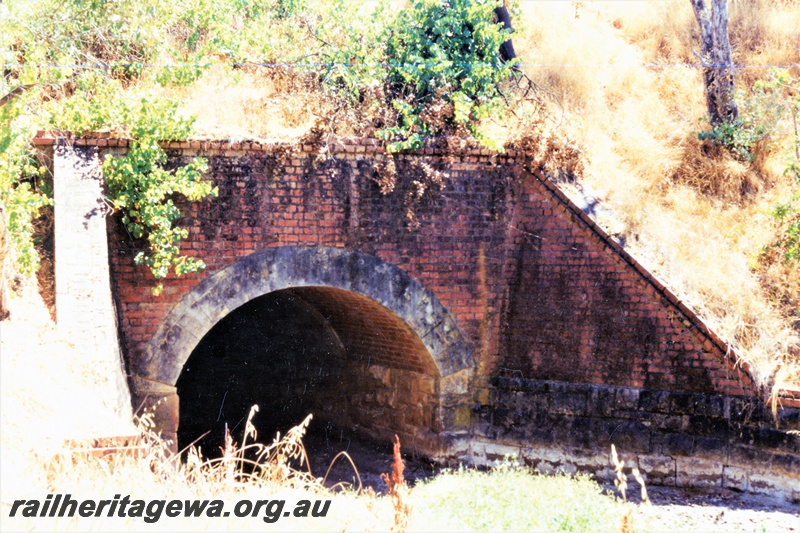 P15490
1 of 2 views of the south entrance to the culvert on the abandoned ER line at Werribee, the face and the wing walls of the culvert are of brick construction

