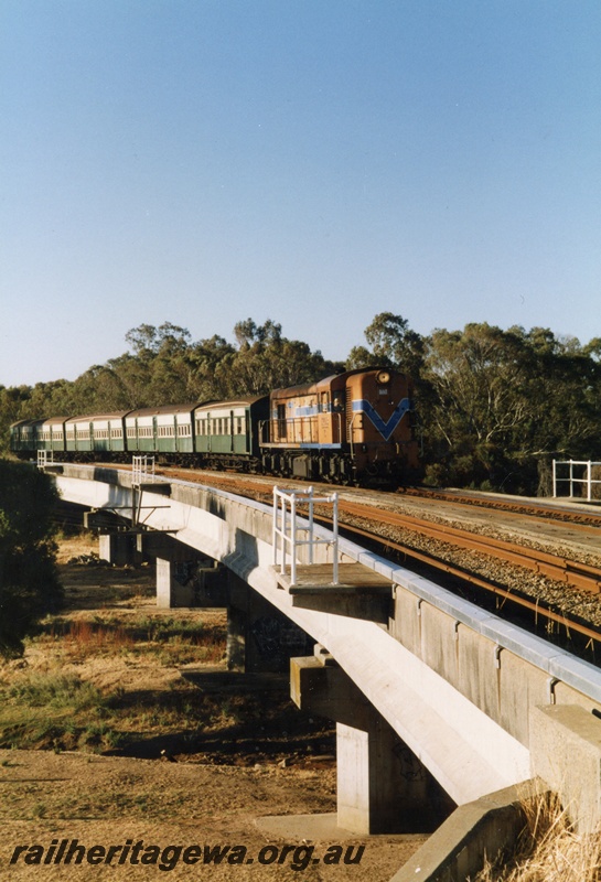 P15494
C class 1702 hauls a rake of wooden bodied suburban carriages in the green and cream livery on the Woodbridge triangle towards Forrestfield the last day of services for these carriages
