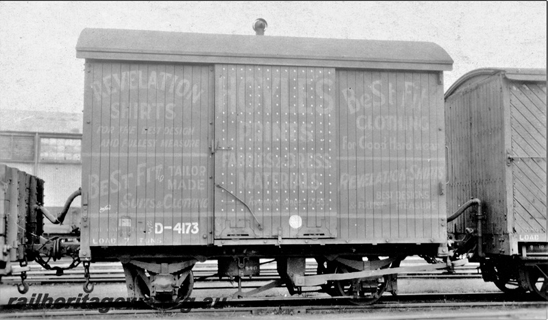 P15568
D class 4173 four wheel van with a single torpedo ventilator on the roof, advertisement for Hoyles Fabrics & dress Materials painted on the side, side view
