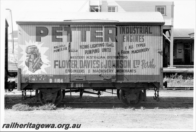 P15570
D class 1184 four wheel van with a advertisement for 