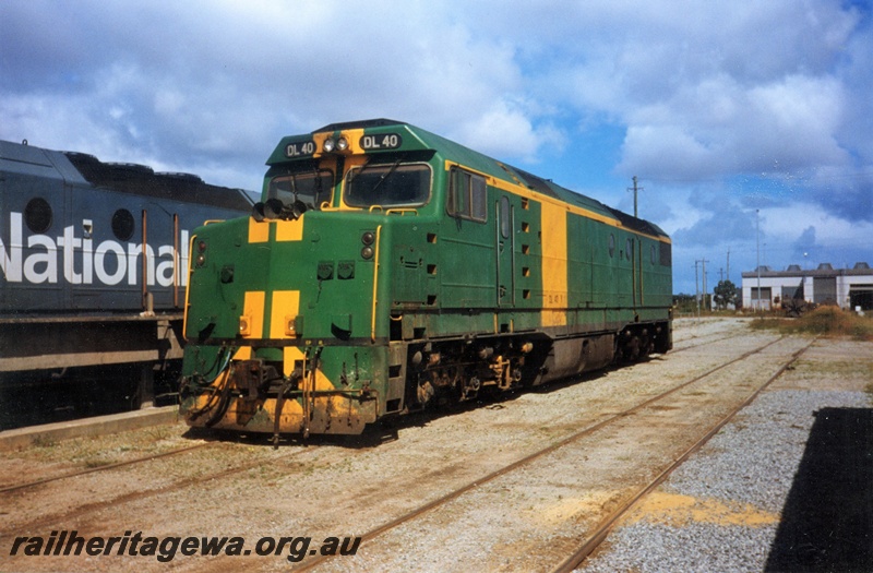 P15583
Australian National DL class 40Y in the green livery with yellow stripes on the nose and a yellow panel on the side, Forrestfield Yard, front and side view

