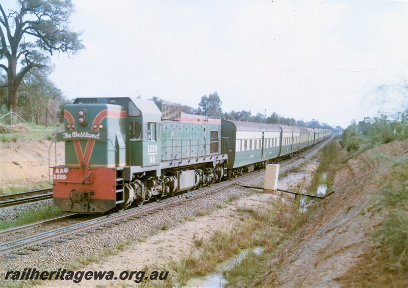 P15877
AA class 1519, in green with red and yellow stripe livery, heading the 