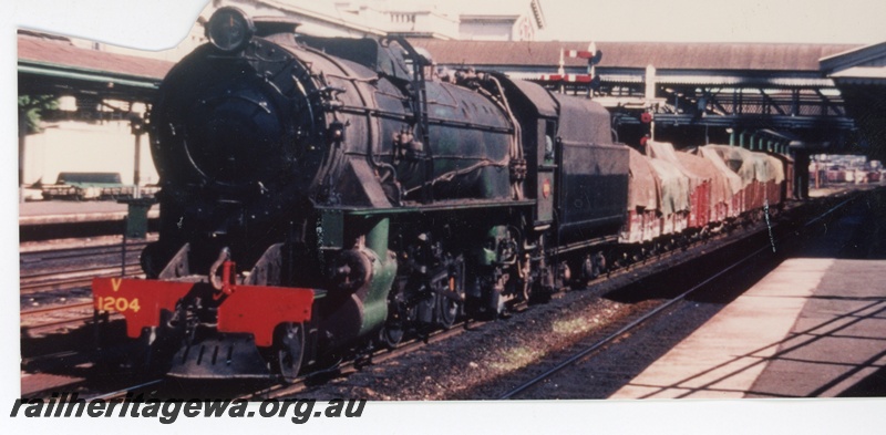 P16370
V class 1204, on goods train, platforms, canopies, bracket signal, overhead footbridge, Perth station, front and side view
