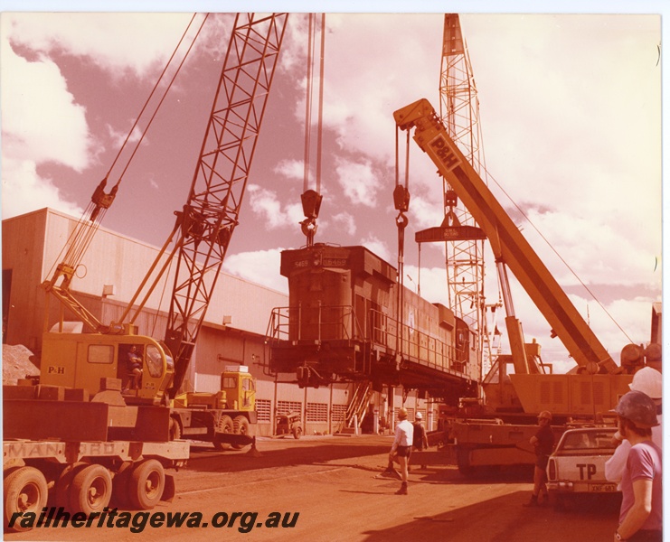 P16742
Mount Newman (MNM) C636 class 5469 being lifted onto low loader at Newman workshops. The loco was being prepared for transport to Comeng for rebuilding
