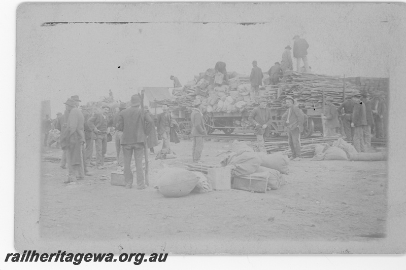 P16813
Commonwealth Railways (CR) - TAR line workers unloading materials from construction train. c1916
