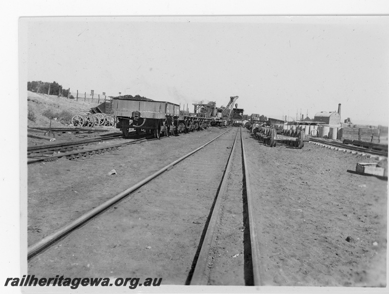 P16852
Commonwealth Railways (CR) - TAR line Port Augusta workshops. Photo shows dual gauge track wagons and coal loading facility.
