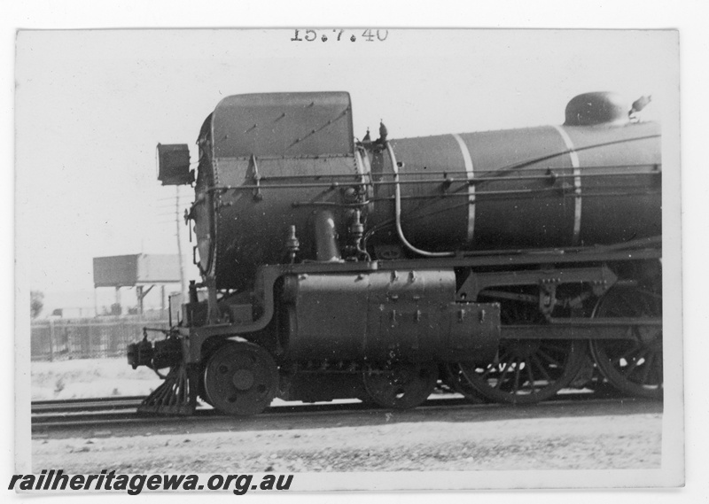 P16853
Commonwealth Railways (CR) - TAR line C class steam locomotive at Port Augusta. Side view of locomotive showing smoke box and valve gear and smoke deflectors. 
