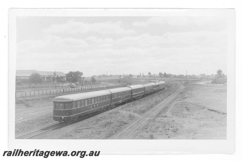 P16884
Commonwealth Railways (CR) - TAR line rear view of train near Port Augusta showing ARF class Observation Lounge. 
