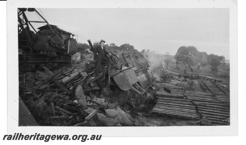 P16924
L class 248 on No. 80 Goods derailed near Kalguddering, EM line,  locomotive upside down amid the rubble, Breakdown crane No. 23 in attendance, Driver was killed in the  derailment. Date of derailment 21/6/1930

