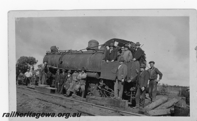P16925
L class 248 on No. 80 Goods derailed near Kalguddering, EM line, loco upright with workersa round, showing damaged locomotive. Side view, Date of derailment 21/6/1930, the driver was killed in the accident.
