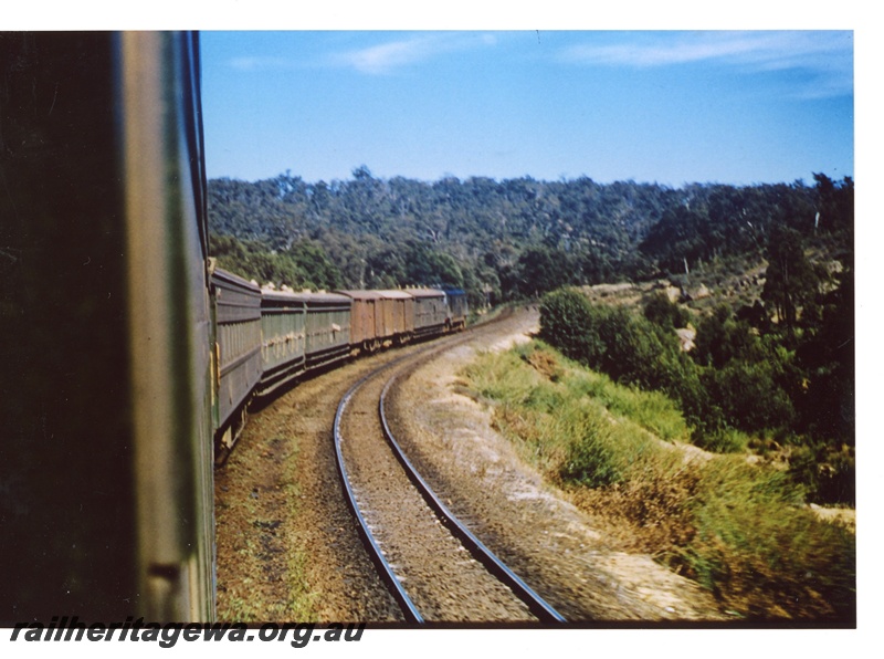 P16988
X class diesel on up express train, including ACL class cars with water bags, sand on adjacent down main, approaching Swan View tunnel, ER line, view from rear of train
