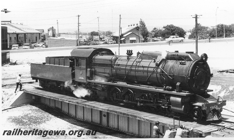 P17038
S class 547 Lindsay on the turntable at East Perth Loco. Note the manual 'pushers' and the East Perth Power house in the background with the M & PE yards in the middle foreground. 

