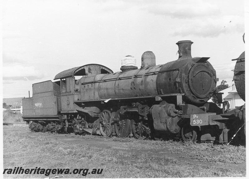 P17073
PR class 530 steam locomotive, side and front view, scrapped with sale lot number painted on the tender, Midland Workshops.
