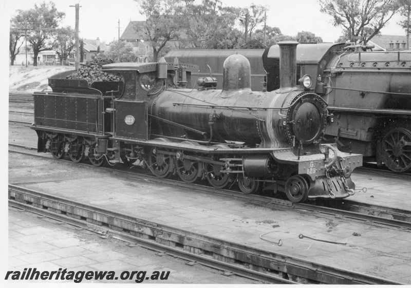P17078
G class 123 steam locomotive, side and front view, over engine pit, East Perth, ER line.
